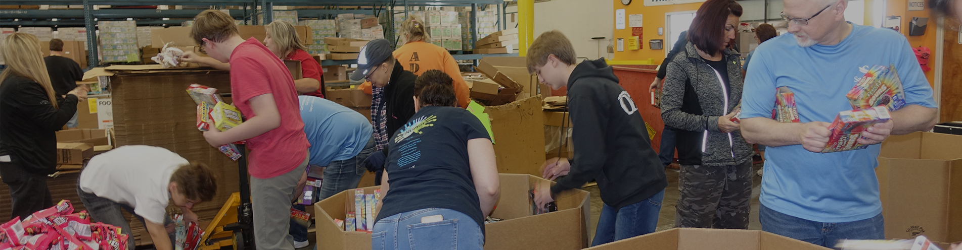 Sagicor Life employees help to pack food boxes at St. Mary's Food Bank in Phoenix